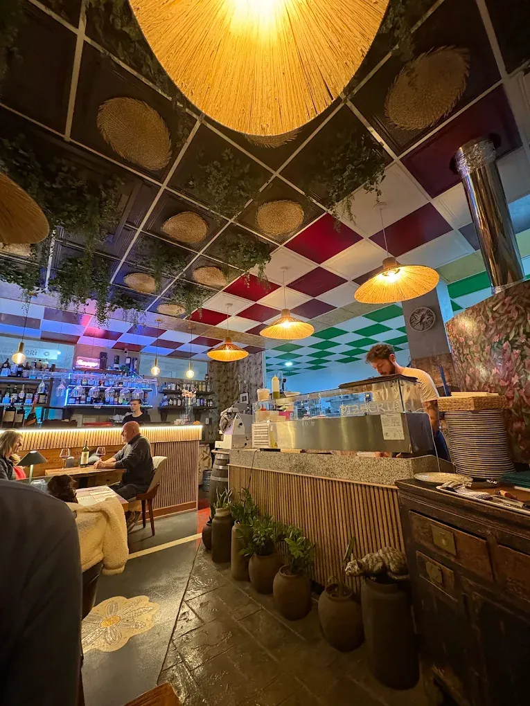 Inside Margher&igrave; Estepona &mdash; rattan lamps, a checkerboard ceiling and the open counter