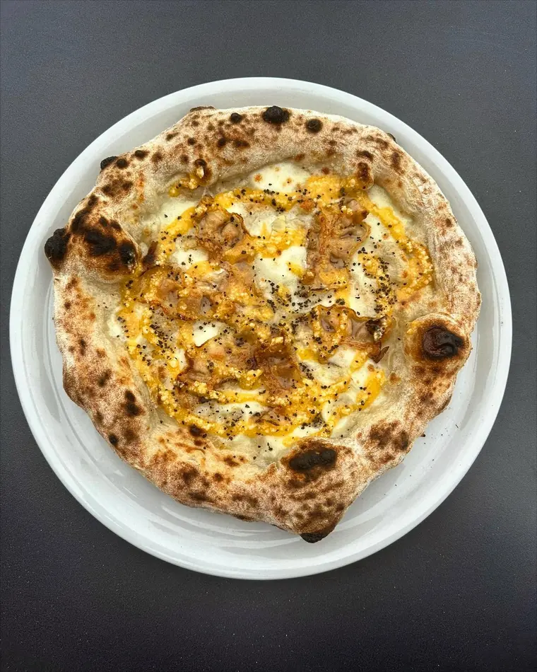 A white pizza fresh from the oven