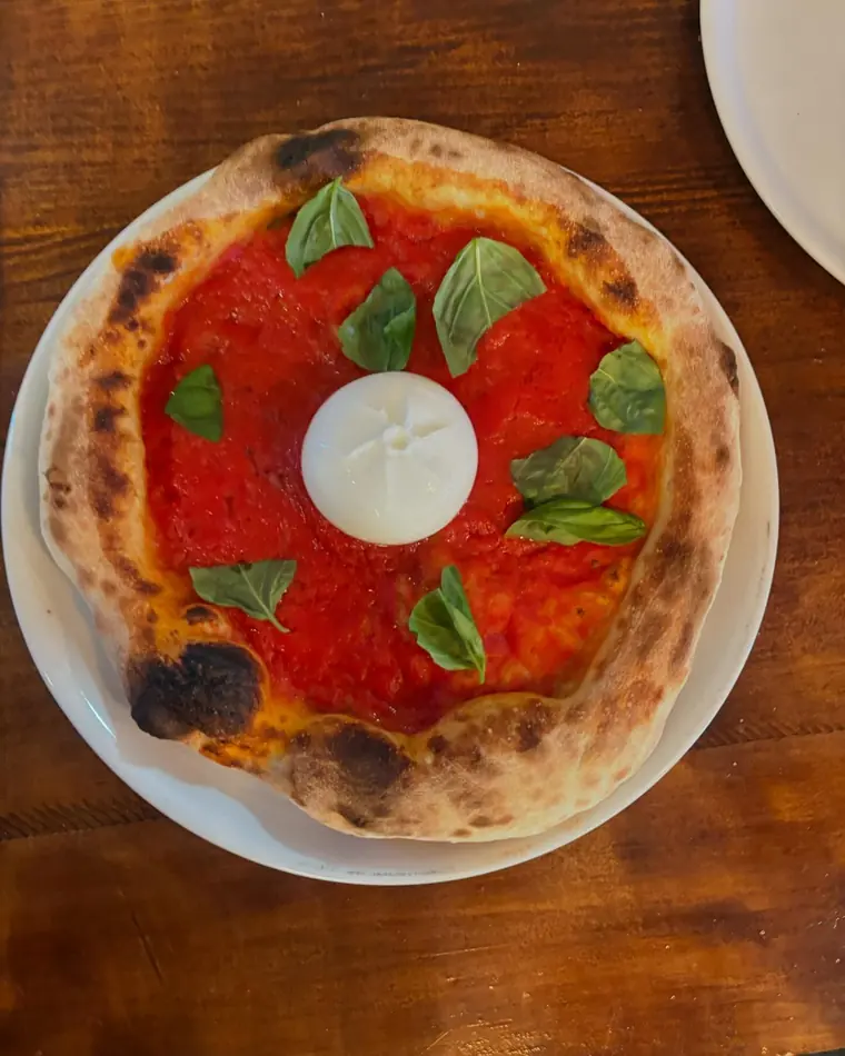 Margher&igrave; burrata pizza with basil