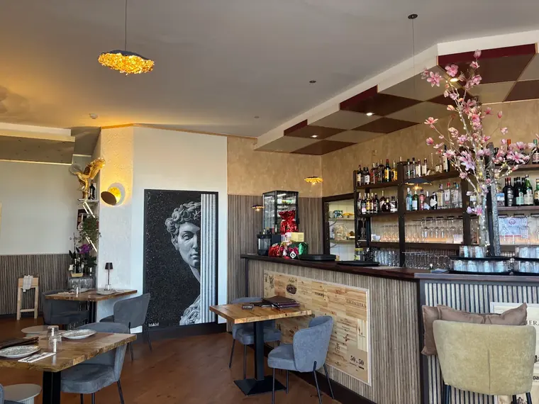 The Sotogrande dining room, warmly lit