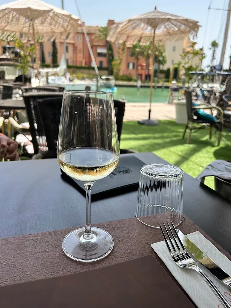 A glass of wine on the Margher&igrave; terrace overlooking Sotogrande marina